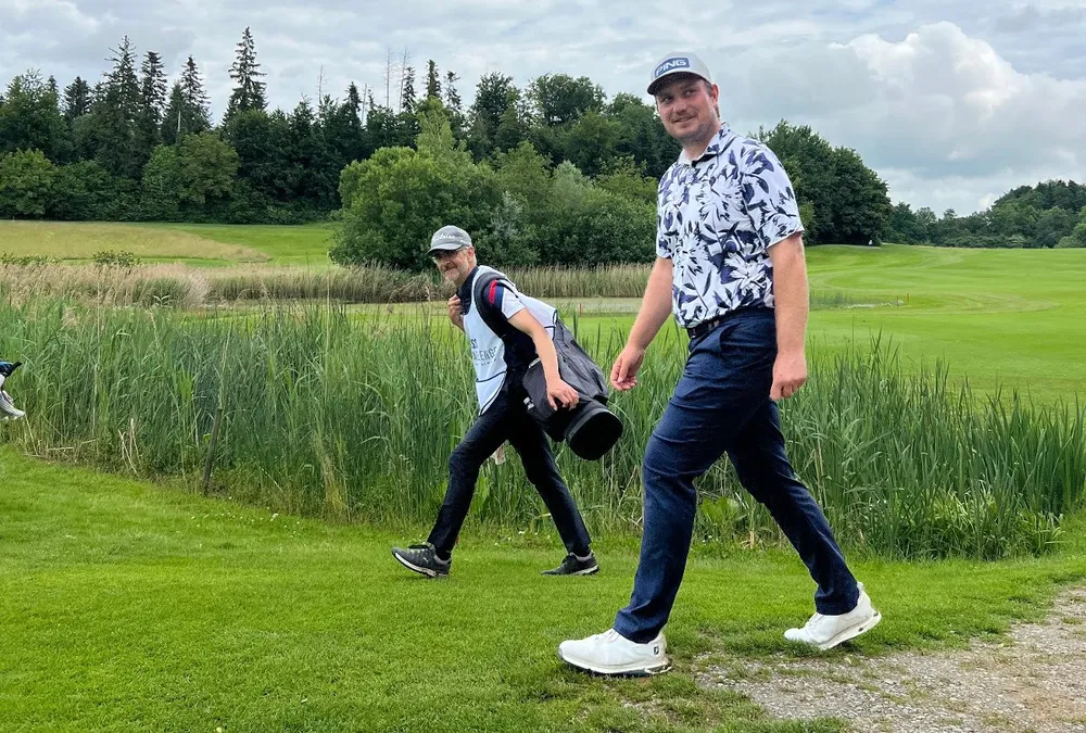 Bård Skogen alongside his uncle and caddie at a HotelPlanner Tour event in Switzerland.