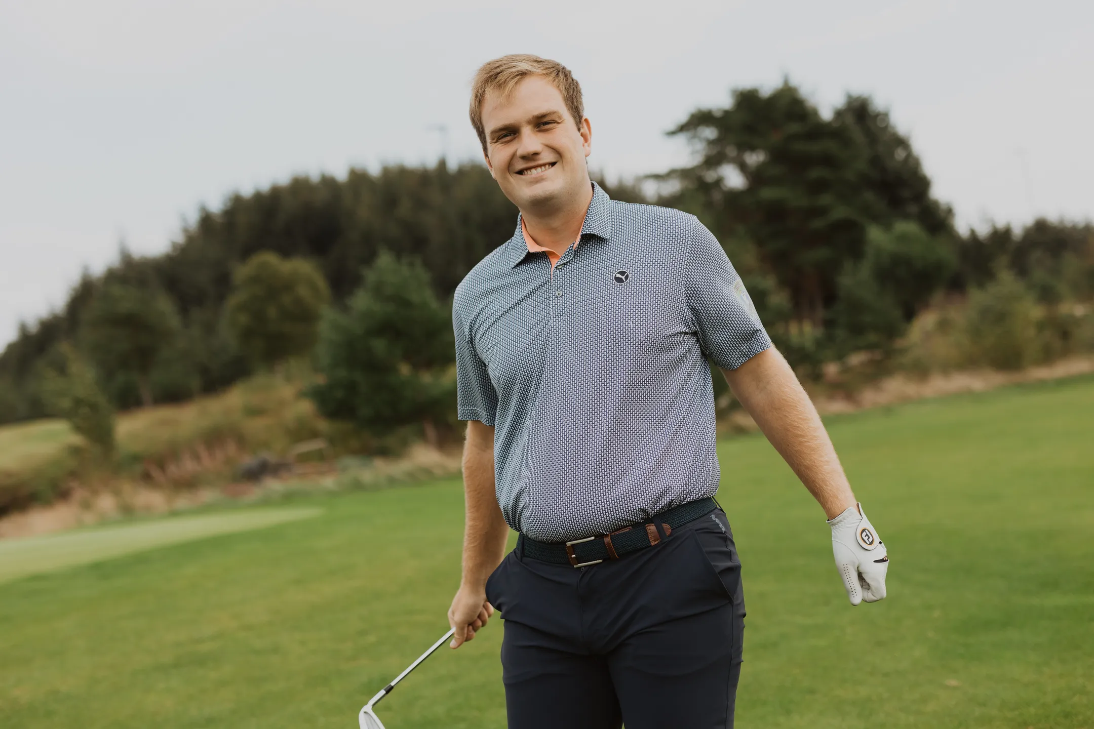 Portrait of Bård smiling with an iron club in his hand